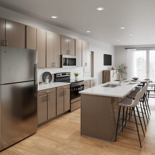 Opulent kitchen adorned with high-end finishes and an abundance of natural light at Veridian in Cincinnati, Ohio