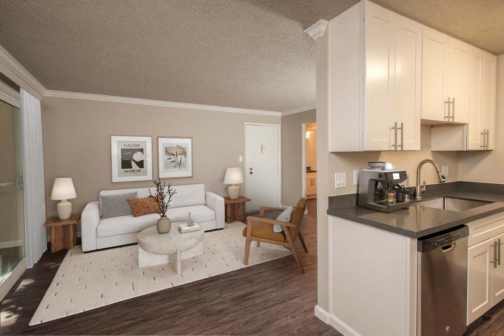 Living room with kitchen at Regency Plaza Apartment Homes in Martinez, California