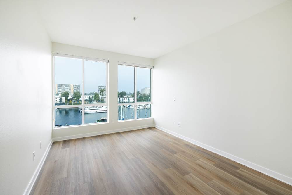 Bedroom overlooking the marina at Capri Apartments in Marina Del Rey, California.