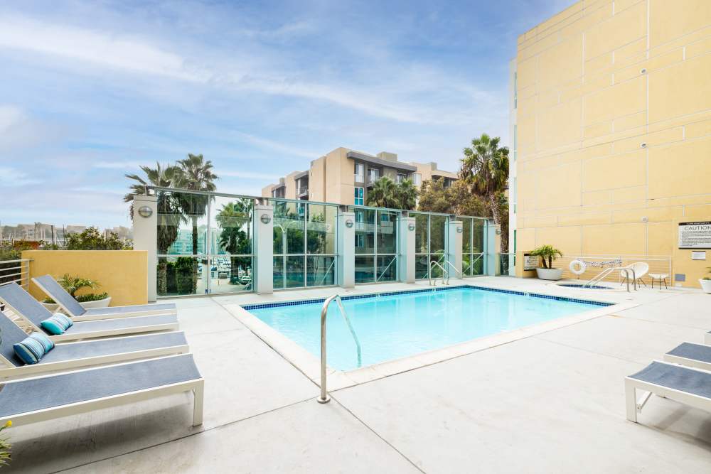 Luxury glass enclosure surrounding a swimming pool at Capri Apartments in Marina Del Rey, California