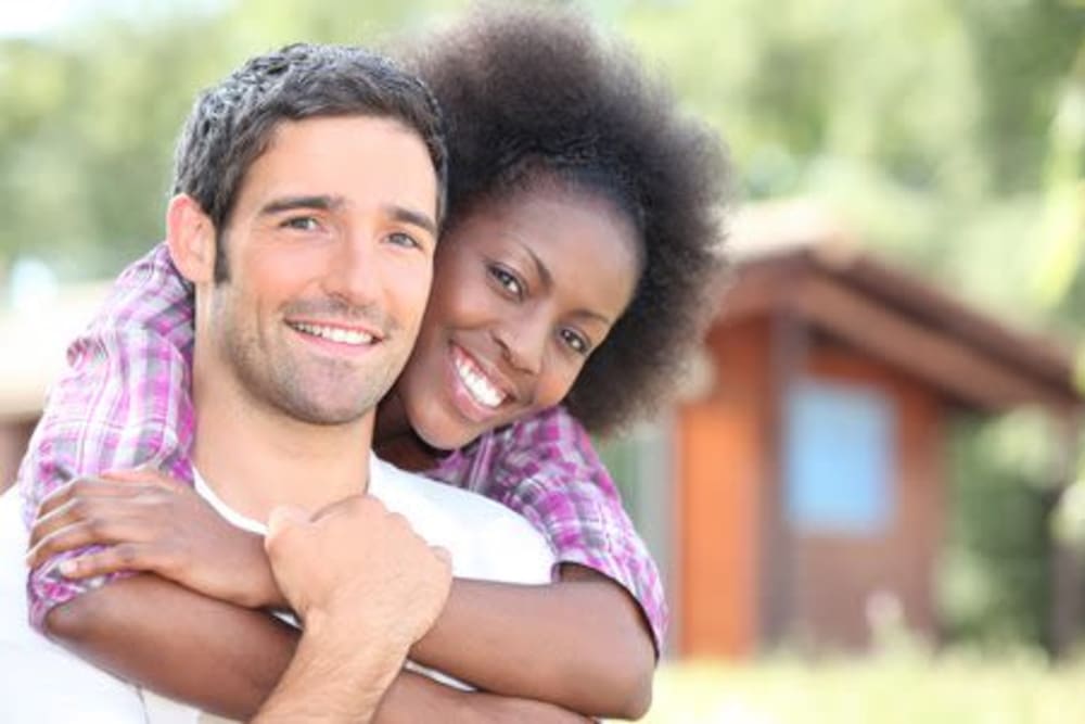 Happy couple at Olympus Court Apartments in Bakersfield, California