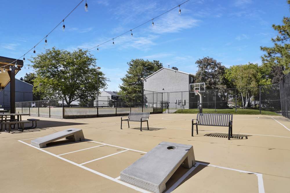 Sport court with corn hole at Royal Farms Apartments in Salt Lake City, Utah
