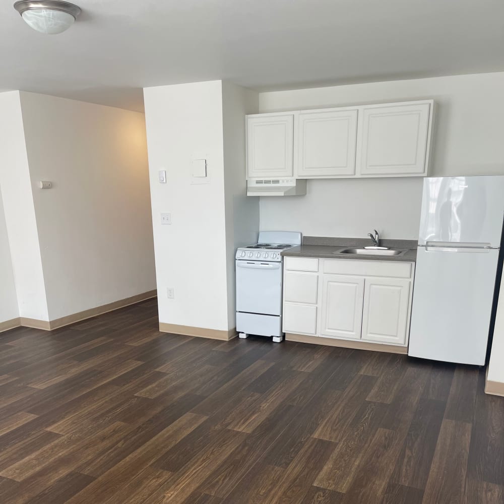 Spacious kitchen with plank flooring at The Winthrop in Tacoma, Washington