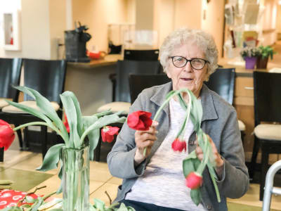 Arranging flowers at Bayberry Commons Assisted Living and Memory Care.