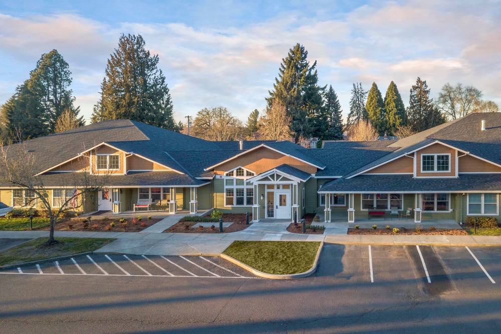 Viewing of the facility at The Springs at Clackamas Woods in Milwaukie, Oregon with towering trees in the background.