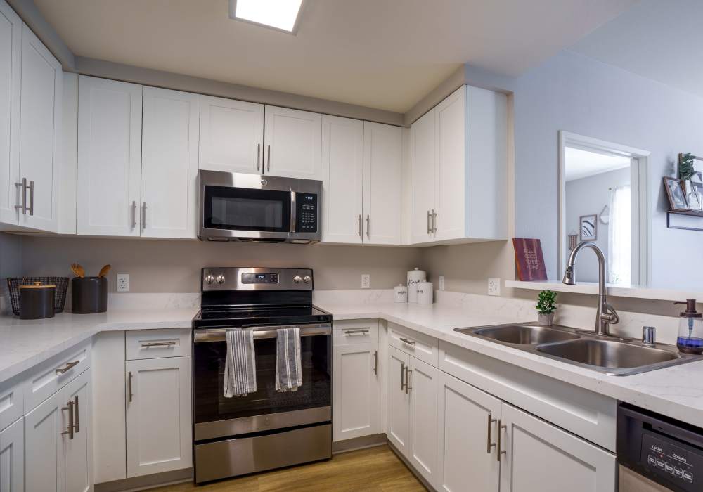Kitchen with energy-efficient, stainless-steel appliances at K Street Flats in Berkeley, California