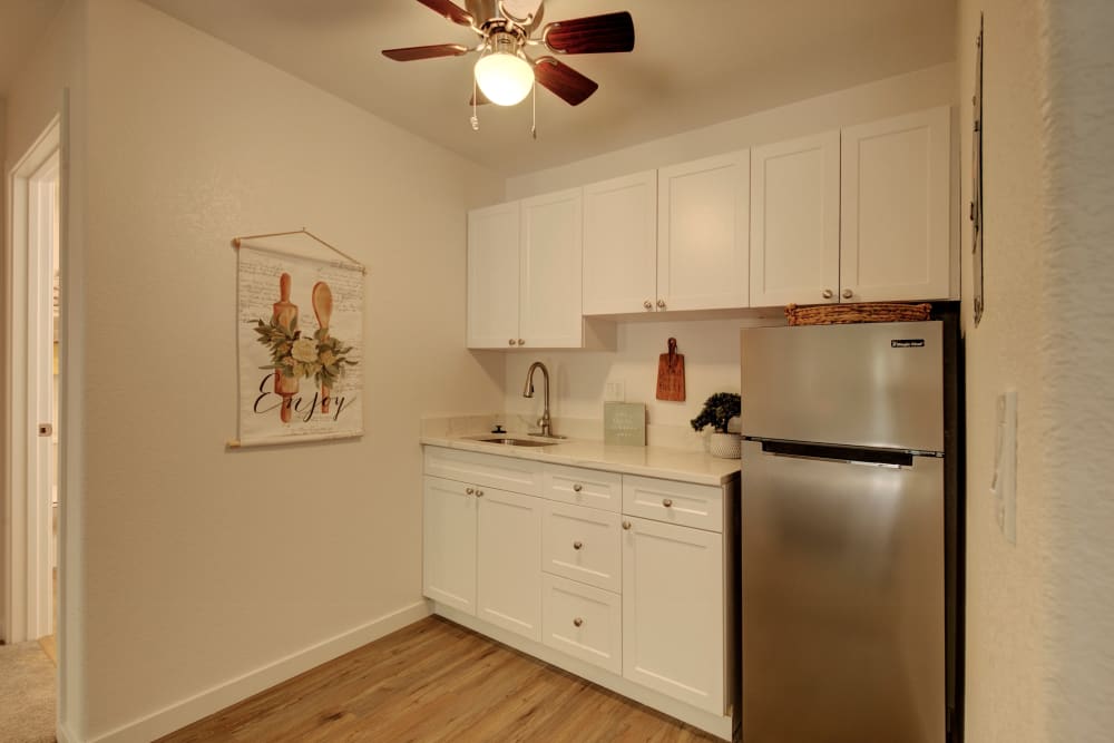 Kitchen with modern furniture at Inglenook At Brighton in Brighton, Colorado