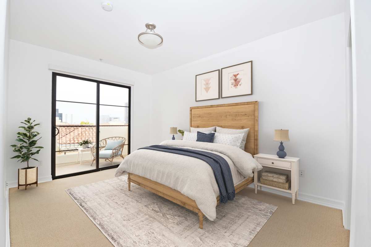Bedroom with large size window at Luxe Villas in Brentwood, California