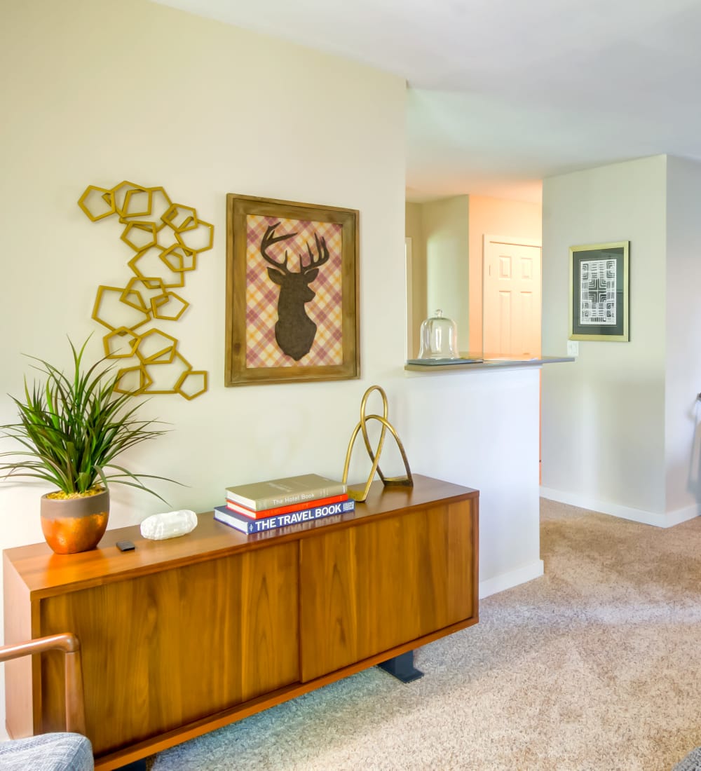 Plush carpeting and retro-modern furnishings in a model home's living area at Sofi at Murrayhill in Beaverton, Oregon