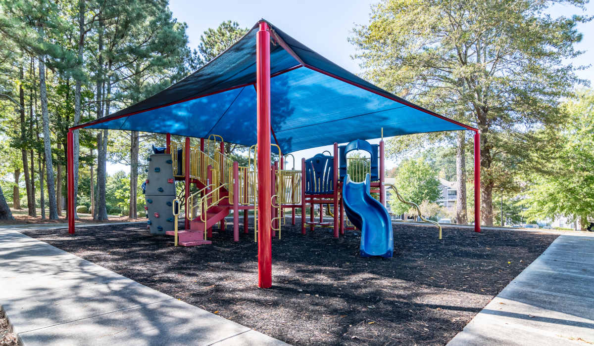 Playground with blue slide and other play equipment at Legacy Ridge in Atlanta, Georgia