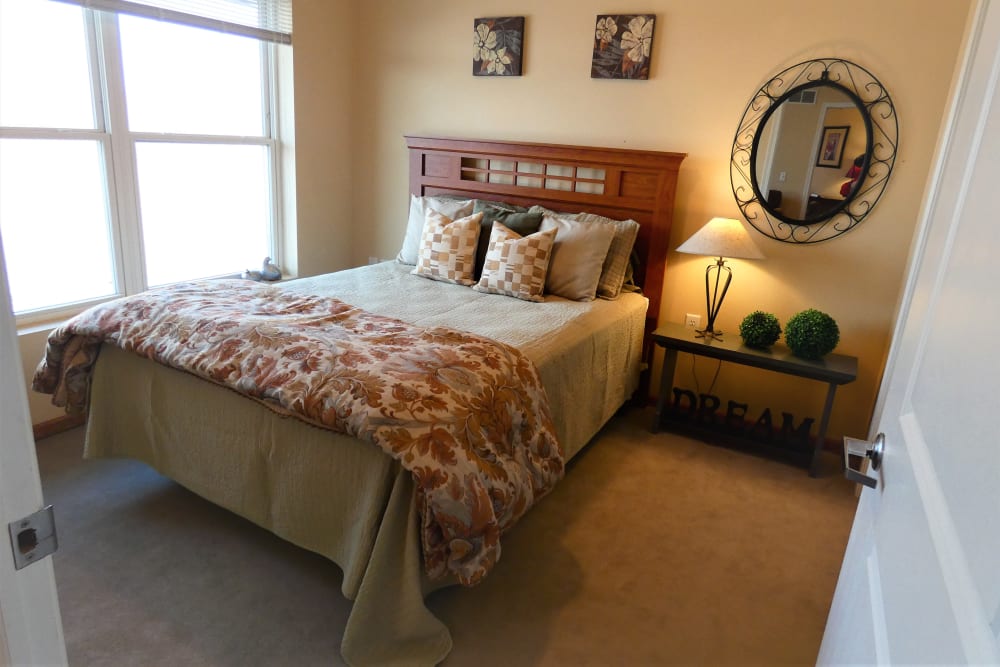 A cozy resident bedroom at The Lakeside Village in Panora, Iowa.