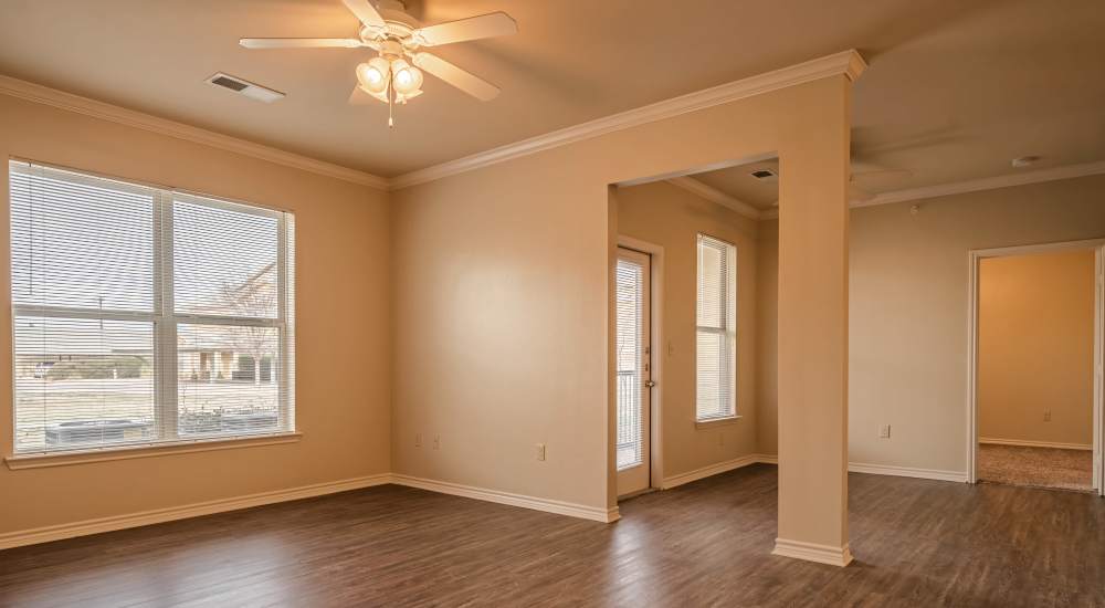 Hardwood plank style flooring and nine foot ceilings of the apartment at Blue Ridge in Midland, Texas