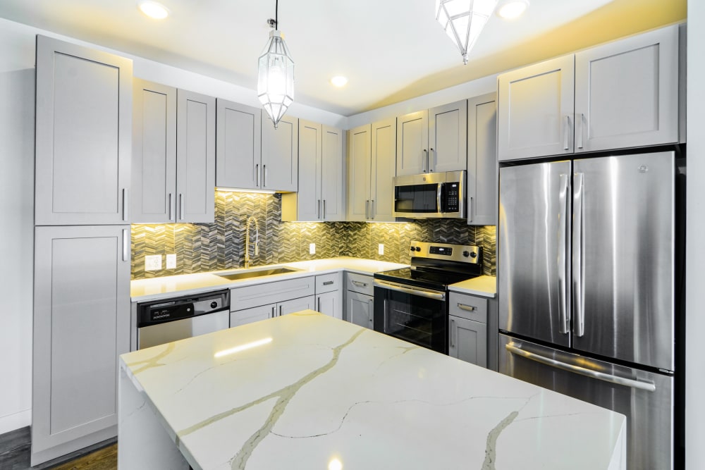 Kitchen with stainless steel appliances at Steelyard Apartments in St. Louis, Missouri