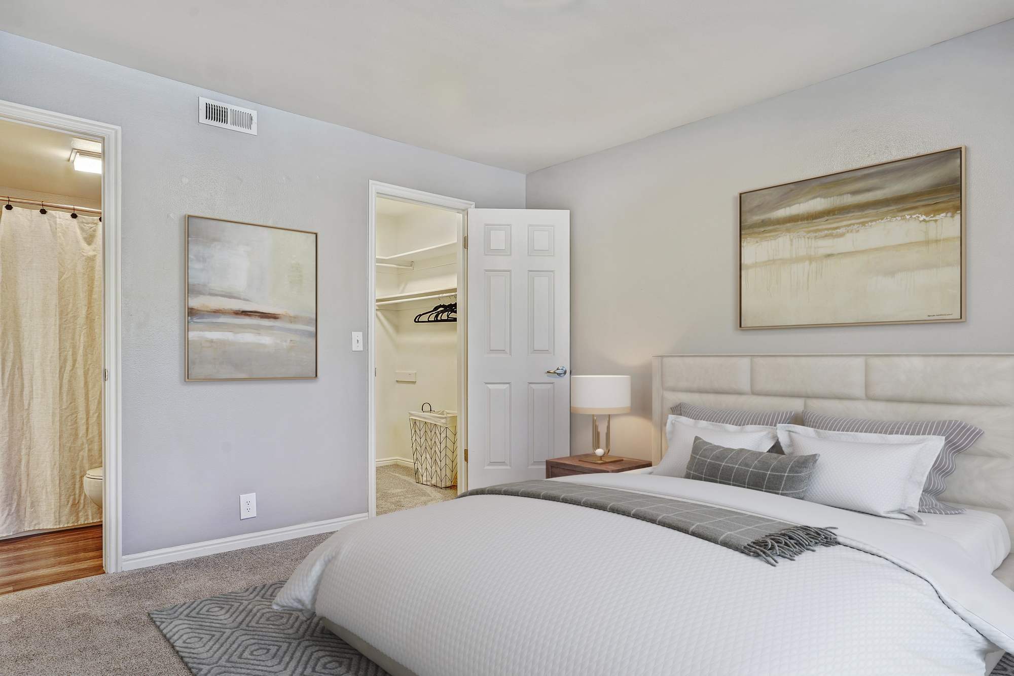 Bedroom view with large window and walk-in closet at Royal Farms Apartments in Salt Lake City, Utah