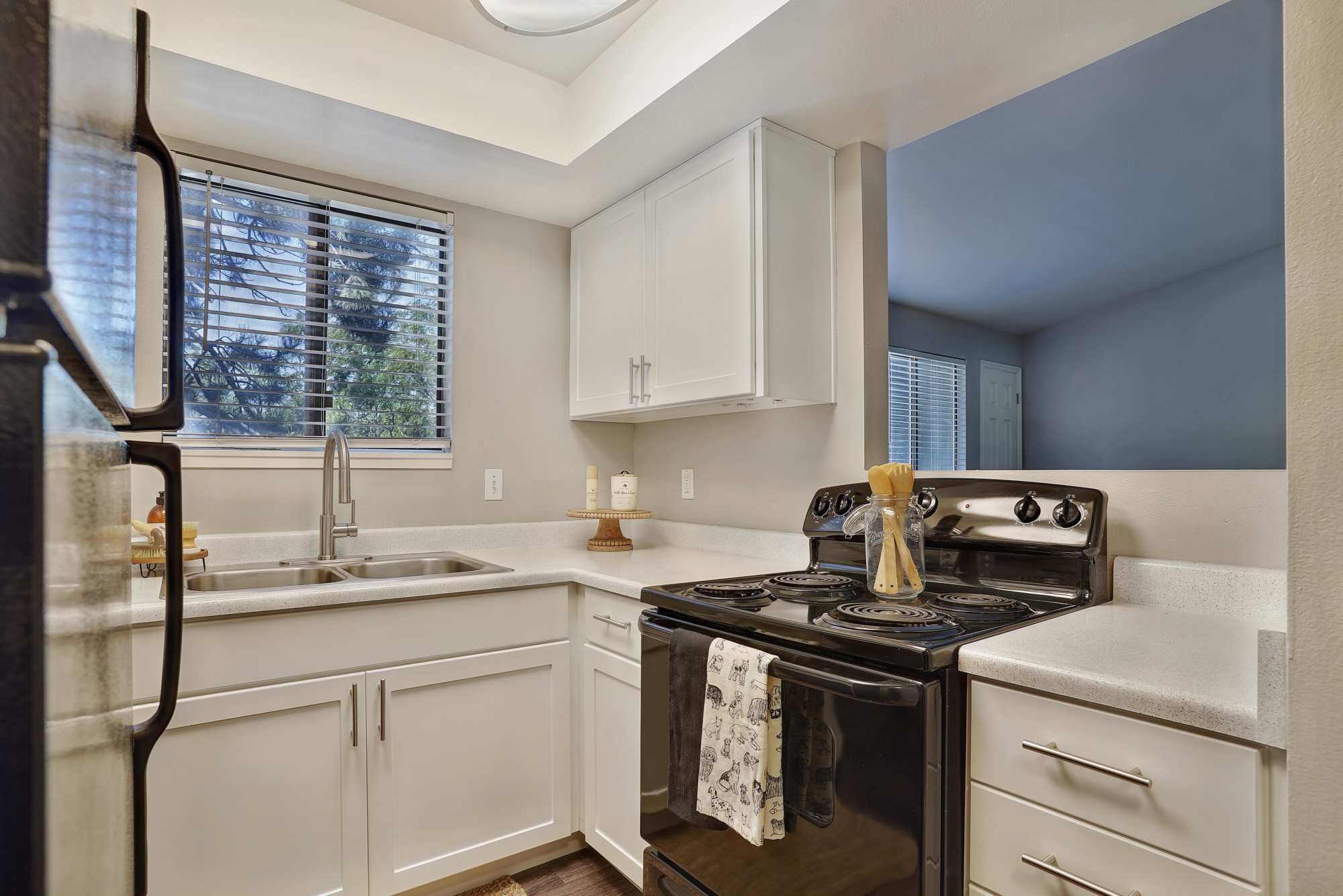 Kitchen with black appliances at Royal Farms Apartments in Salt Lake City, Utah
