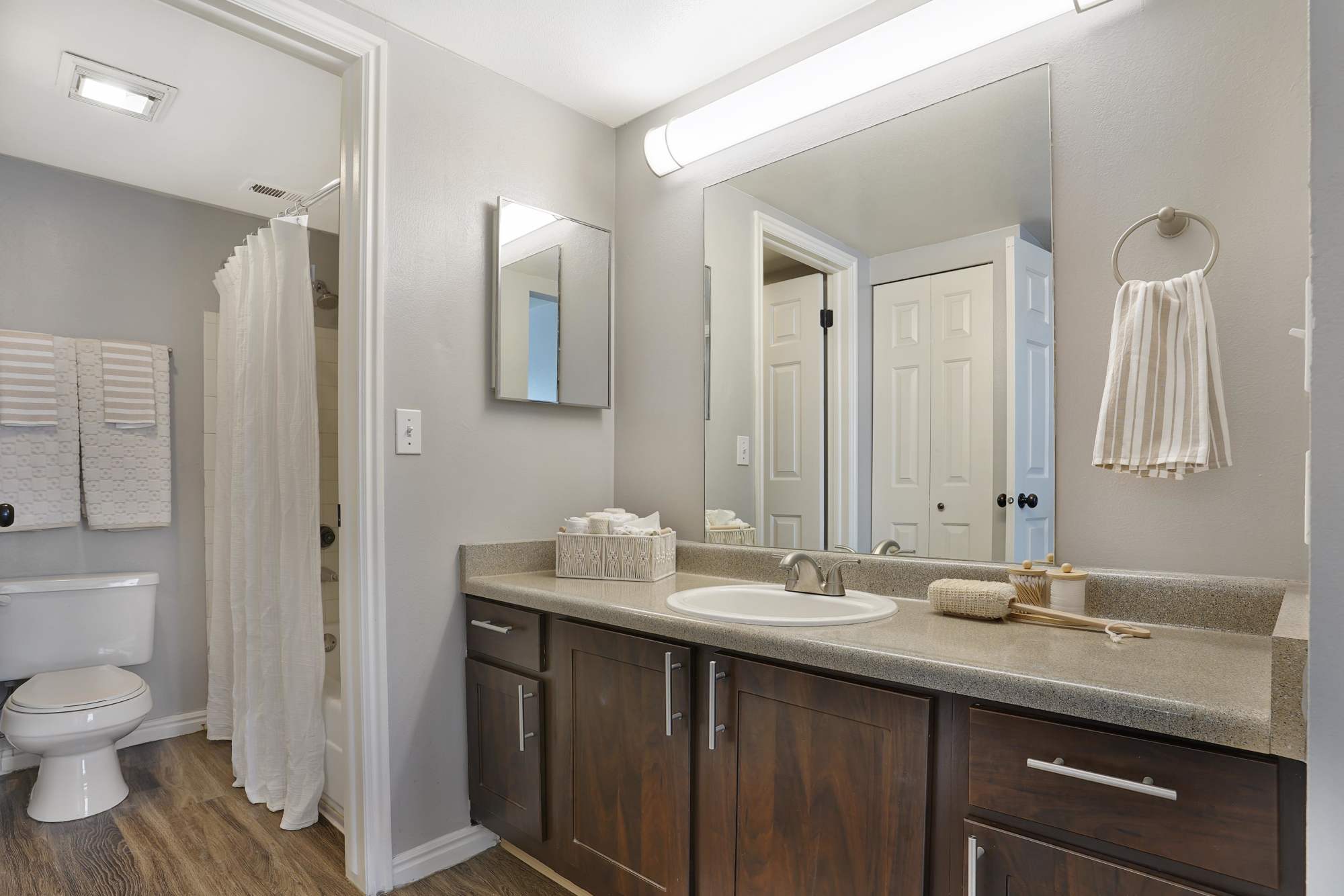 Modern-style bathroom with a large vanity at Royal Farms Apartments in Salt Lake City, Utah