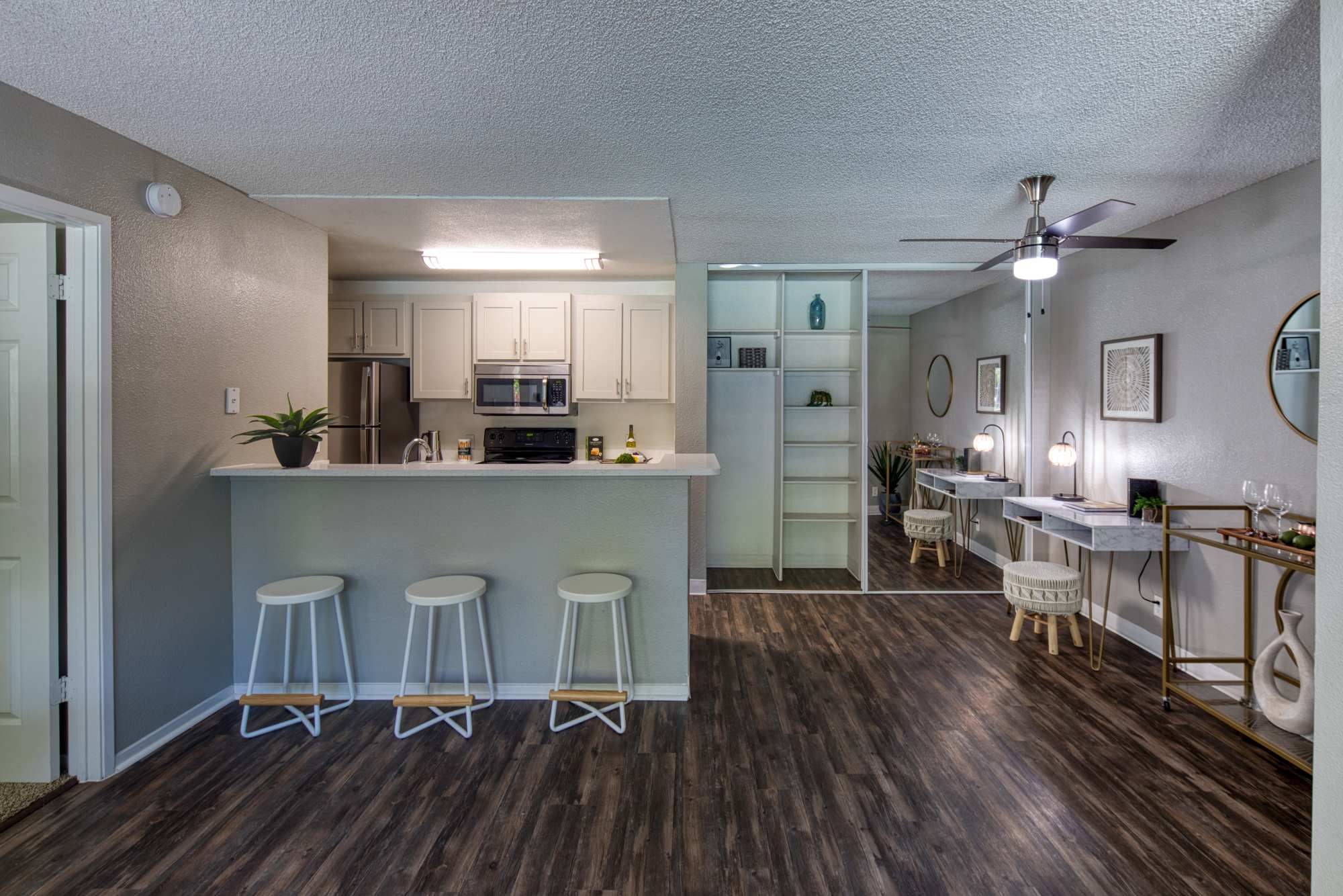 Kitchen with raised countertop and barstool at Falls at Arden in Sacramento, California
