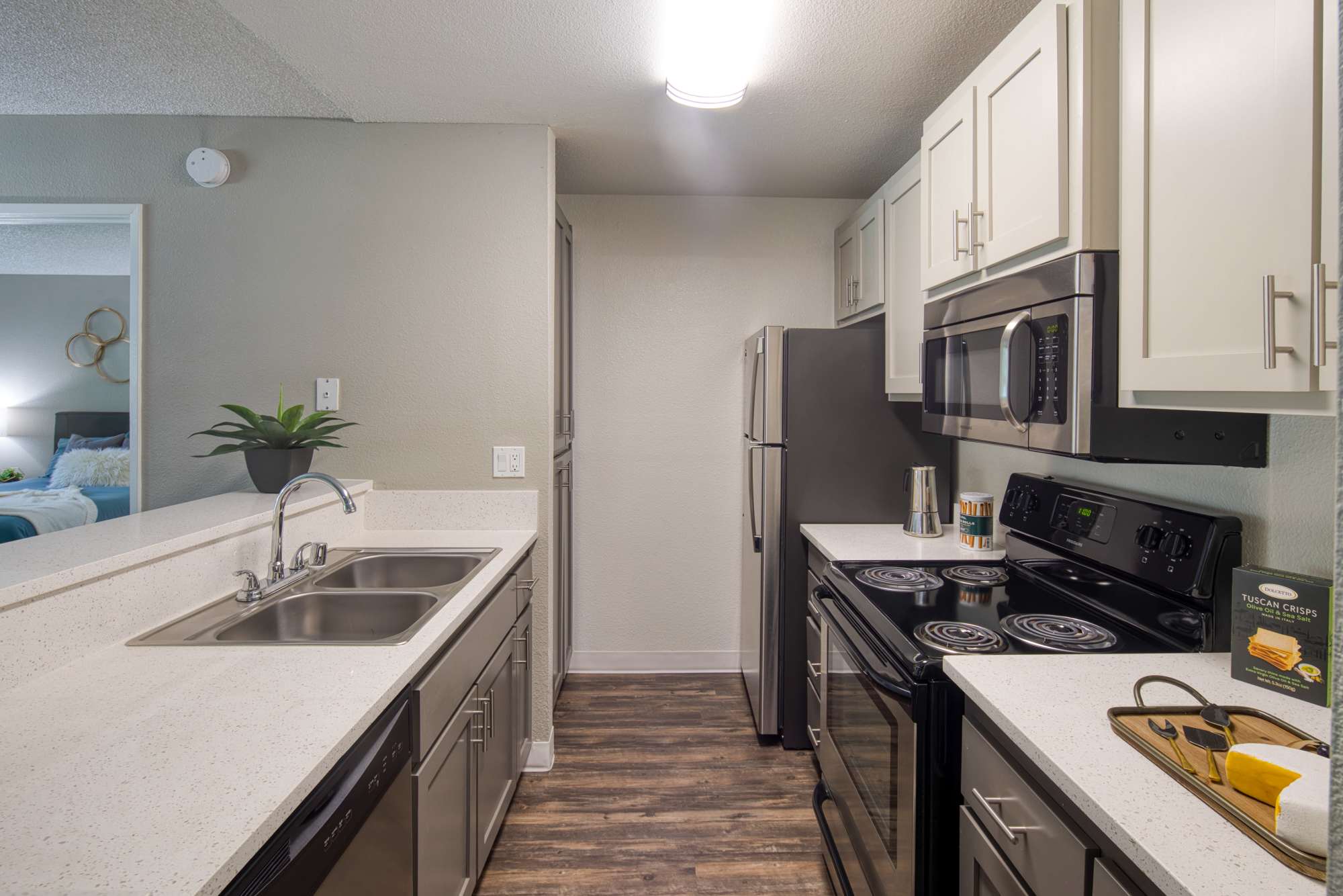 Kitchen with white cabinetry at Falls at Arden in Sacramento, California