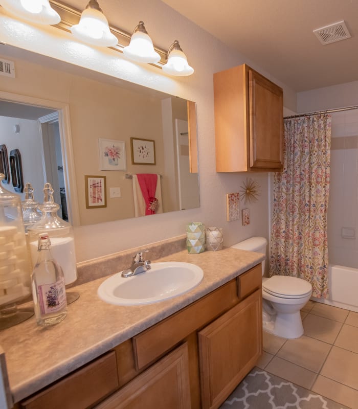 Bathroom with tile flooring at Remington Apartments in Amarillo, Texas