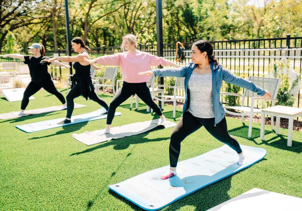 Residents doing yoga at The Waters at Promenade in Marrero, Louisiana