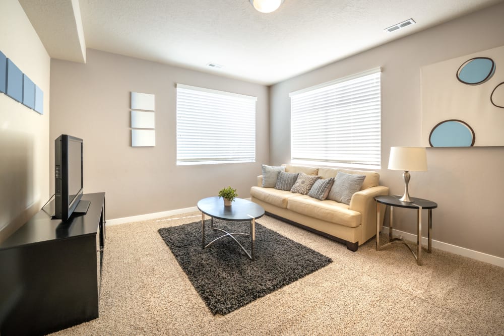 Model living room at Olympus at the District in South Jordan, Utah