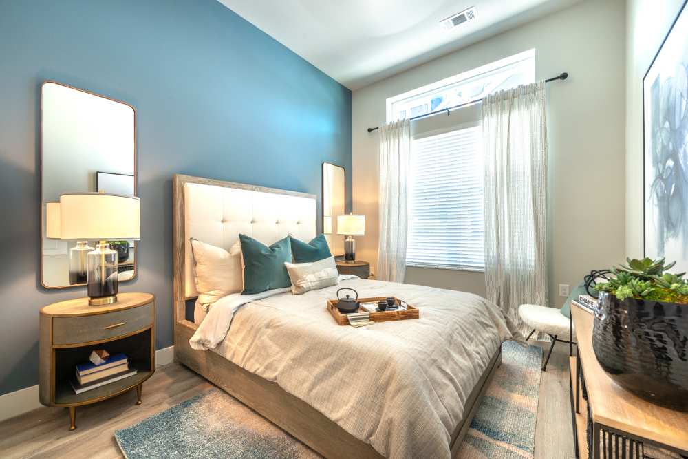 Bedroom with large windows at Cornell Midtown in Dallas, Texas
