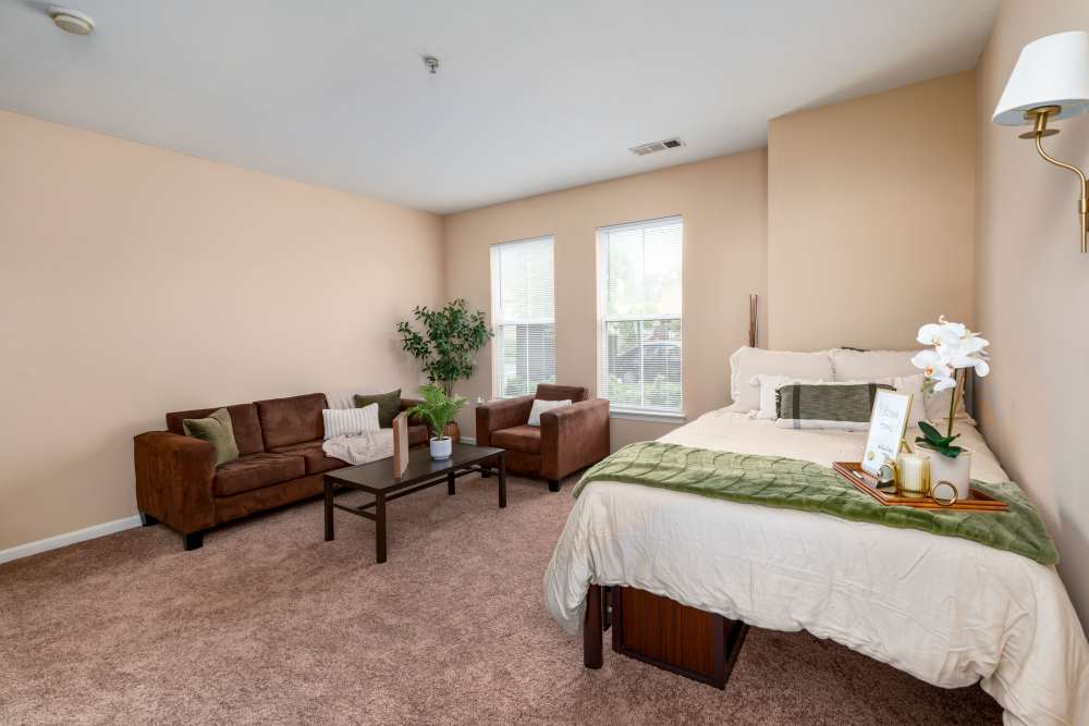 Sudent apartment with bed and couch at Mazza Grandmarc in College Park, Maryland