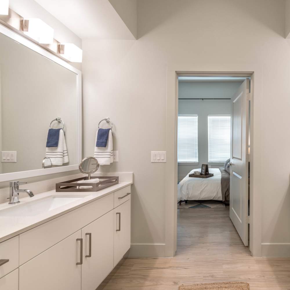 Large storage cabinet in the apartment bathroom at Hall Street Flats in Dallas, Texas