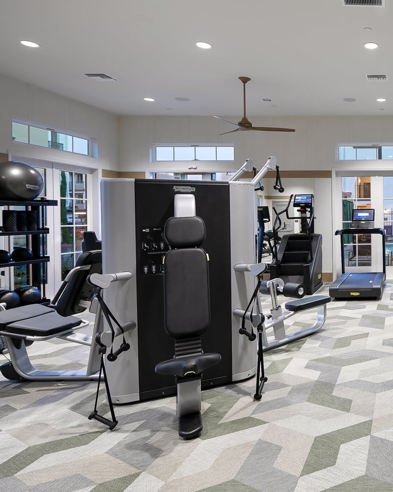 Workout equipment in the fitness center at Alivia Townhomes in Whittier, California