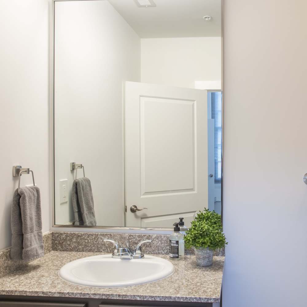 Mirror and vanity sink in the bathroom at Lofts at Inman Mills in Inman, South Carolina