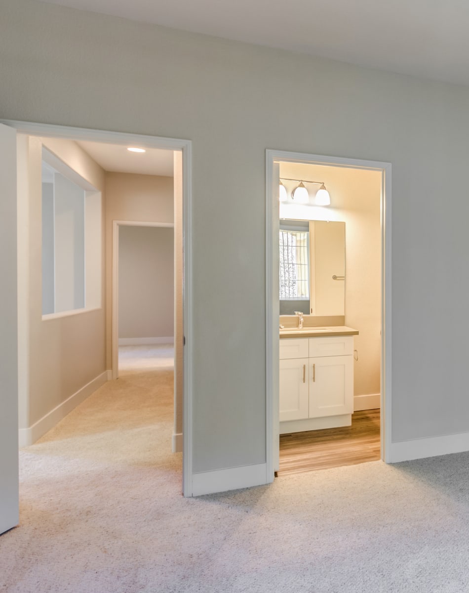 View of the hallway and en suite bathroom from a model home's bedroom at Sofi Westview in San Diego, California