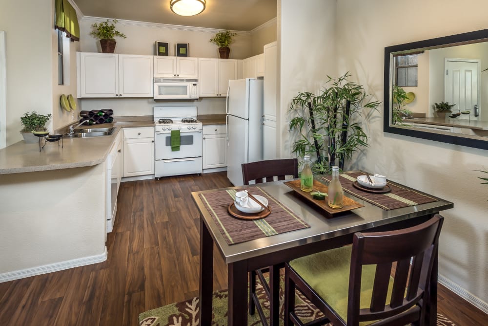 Beautiful open-concept floor plan with hardwood floors in model home at Stone Oaks in Chandler, Arizona