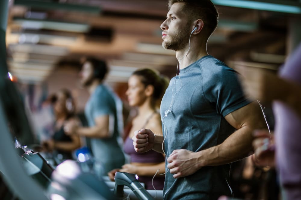 Resident working out at the gym at 770 C Street Apartments in Washington, District of Columbia