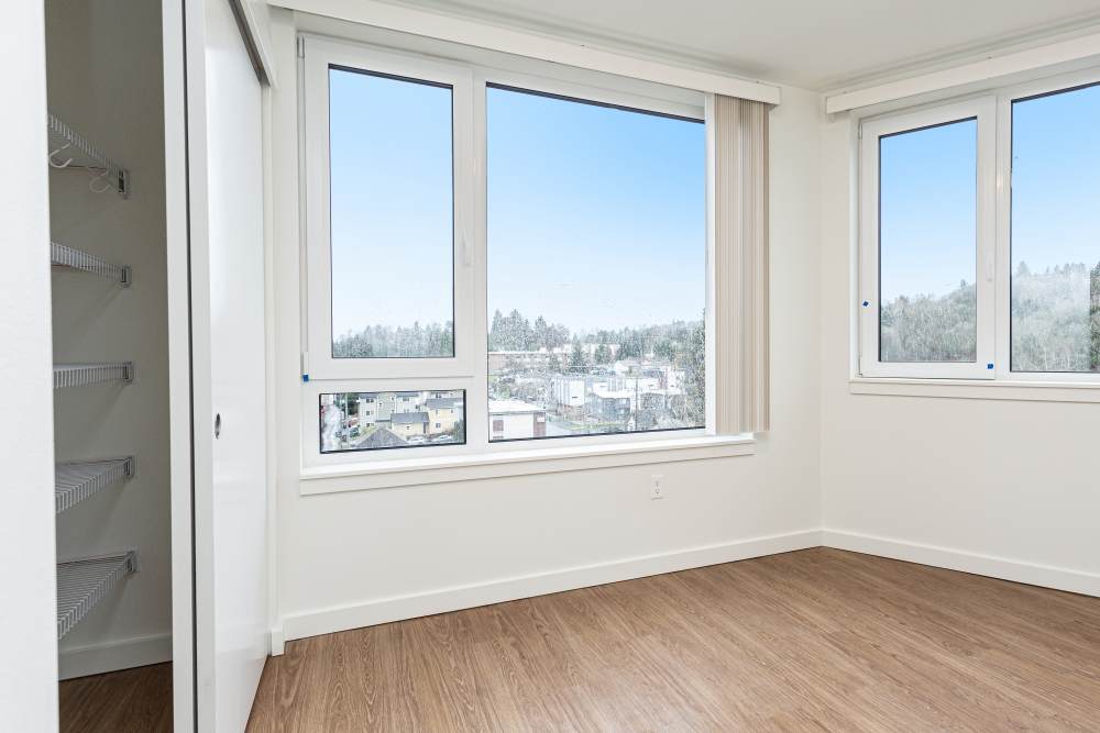 Bright bedroom with closet at Gardner House in Seattle, Washington