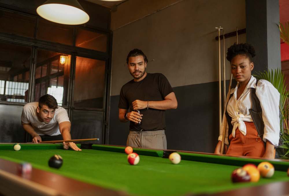 Resident friends playing billiards at RIVA Solana Beach in Solana Beach,California