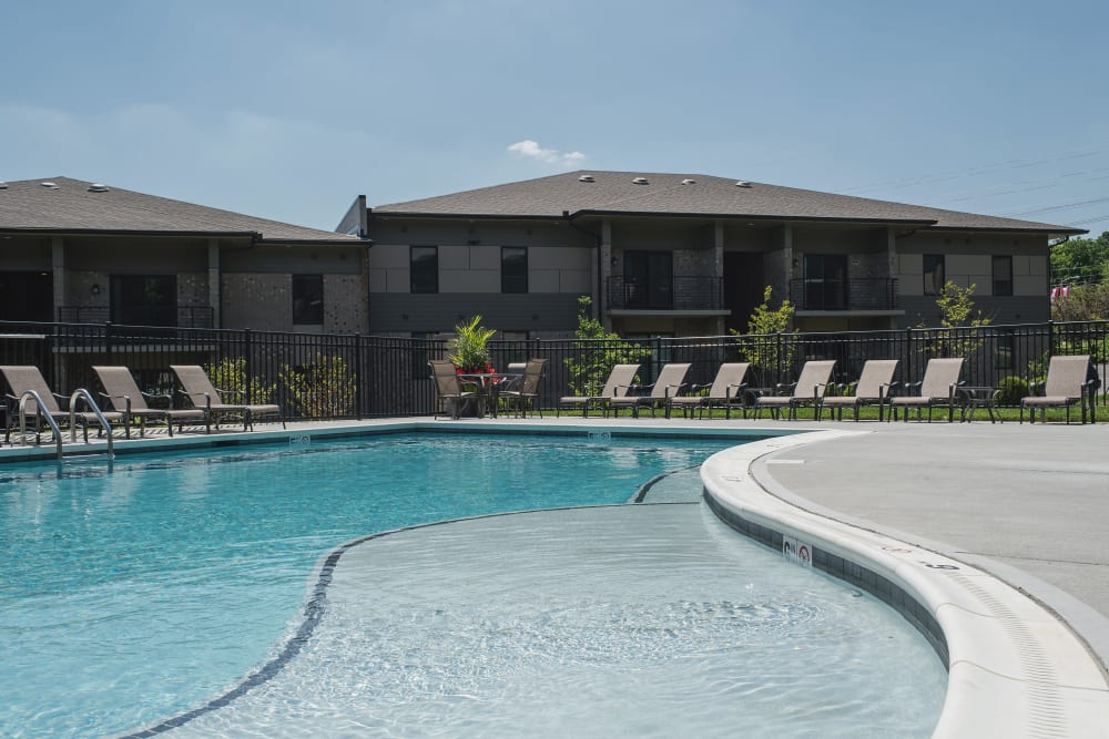 Pool and deck with lounge seating at Lakewood Park Apartments in Lexington, Kentucky