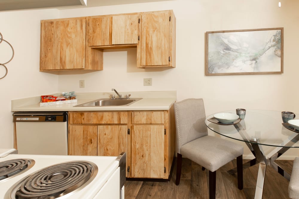 Kitchen with plenty of cabinet space and dining room at Callaway Apartments in Taylorsville, Utah