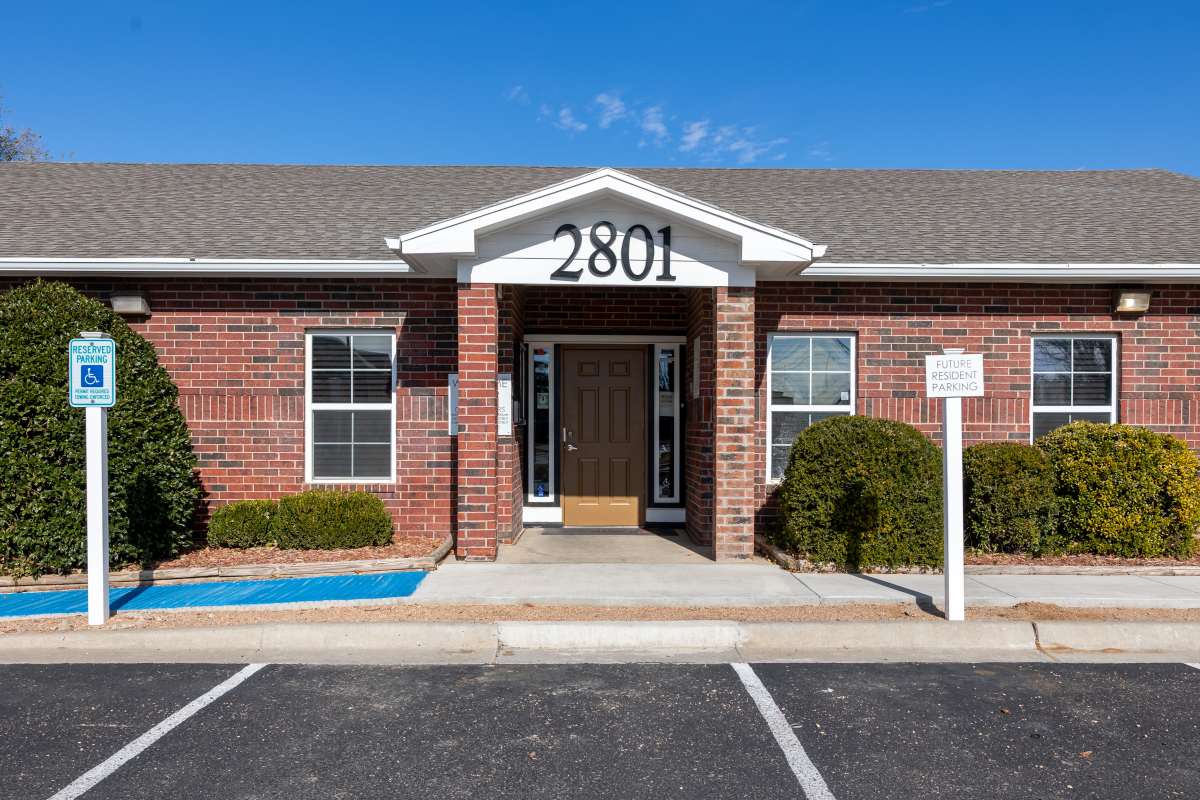 Property exterior with parking spaces at North Grand Villas in Amarillo, Texas