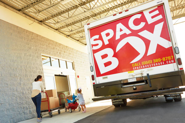 A family moving using the free moving truck at Spacebox Storage Crestview in Crestview, Florida.