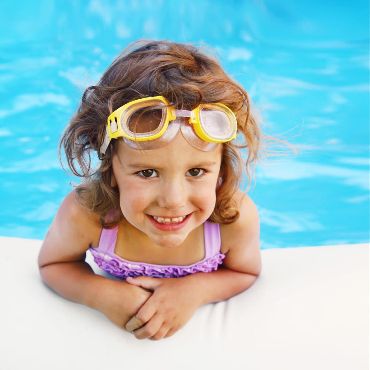 Kid in a pool at a Viva Communities home