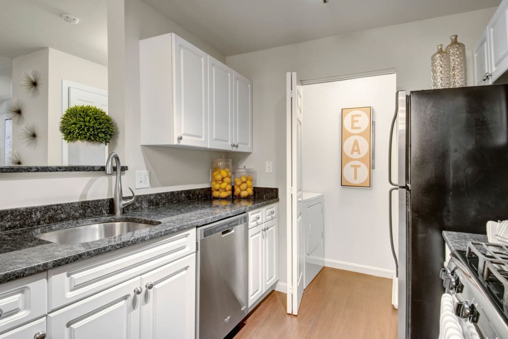 Kitchen with stainless steel appliances at Ellington Metro West in Westborough, Massachusetts