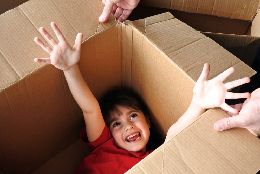 Kid playing inside a box at Summit Self-Storage in Victor, Idaho