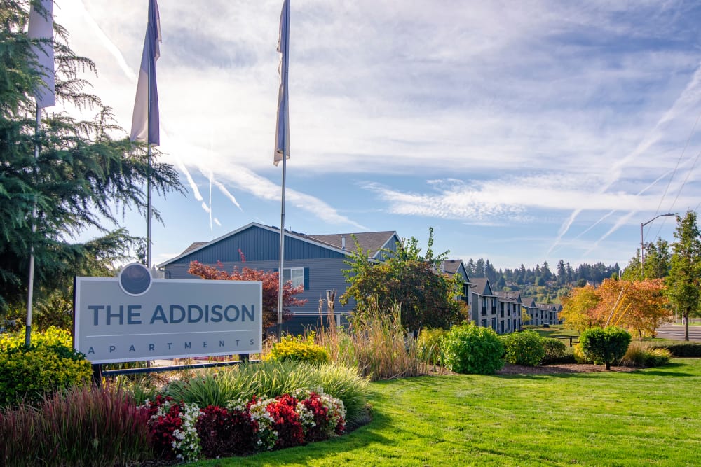 The front sign on a sunny day at The Addison Apartments in Vancouver, Washington