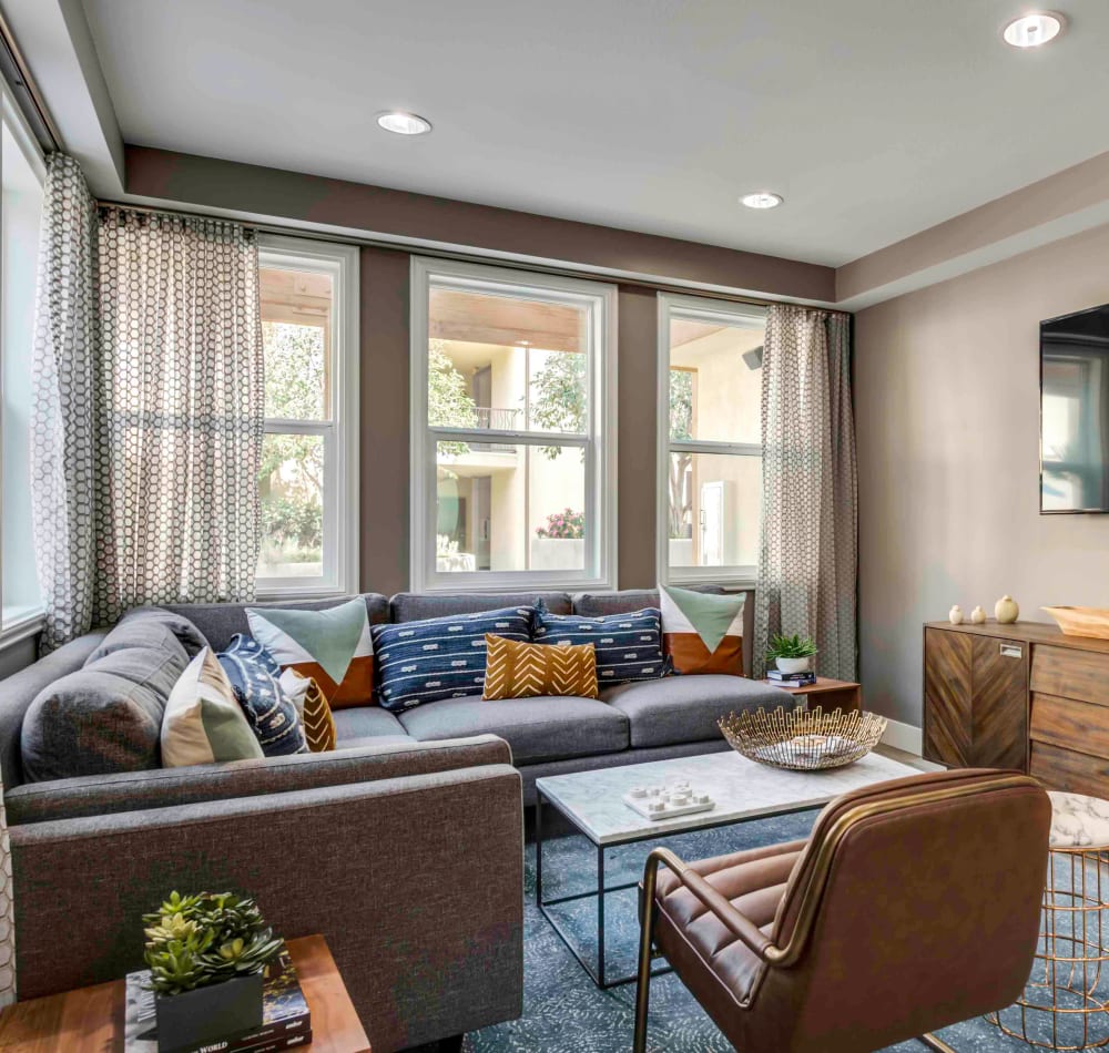 Spacious and well-decorated open-concept living area in a model home at Sofi at Topanga Canyon in Chatsworth, California