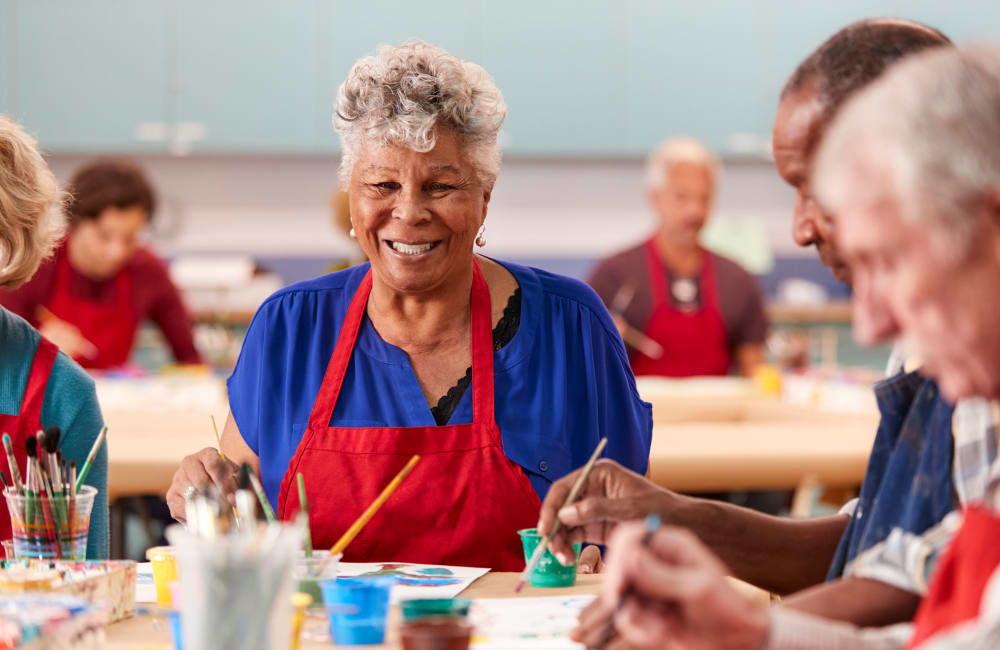 Resident working on arts & crafts with a group at York Gardens in Edina, Minnesota