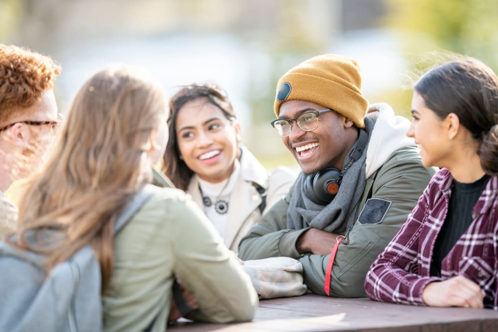 Friends chatting outside in Flagstaff, Arizona near UNCOMMON Flagstaff