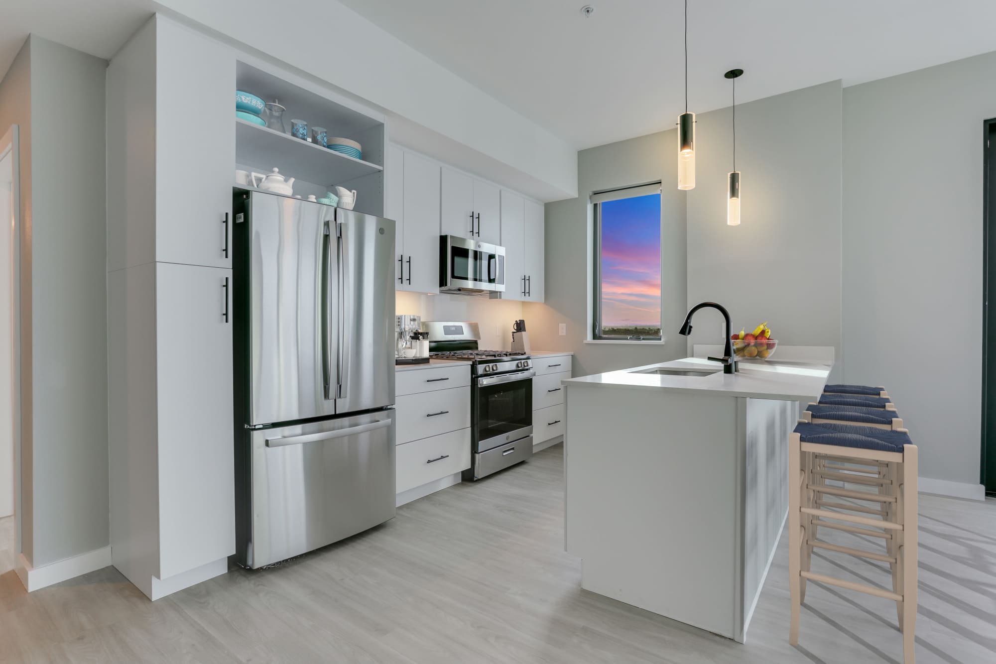 Kitchen with white cabinetry at The Columbia at the Waterfront in Vancouver, Washington