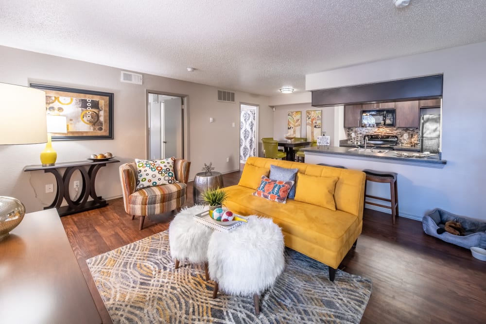 Open concept floor plan with hardwood floors and modern decor at Trails of Towne Lake in Irving, Texas