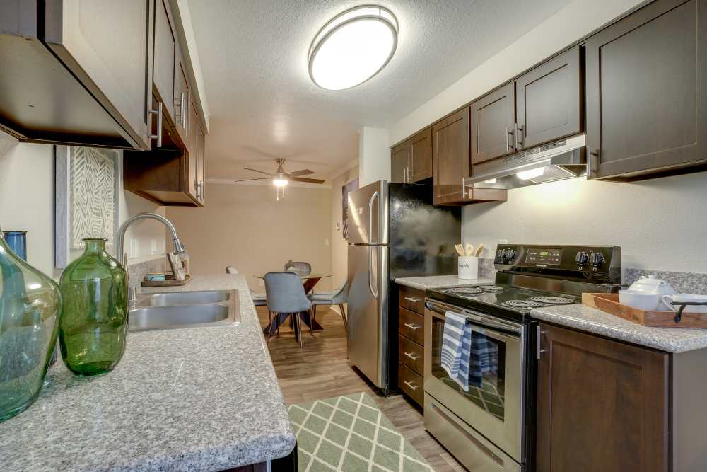 Modern kitchen with stainless-steel appliances at Walnut Grove Landing Apartments in Vancouver, Washington