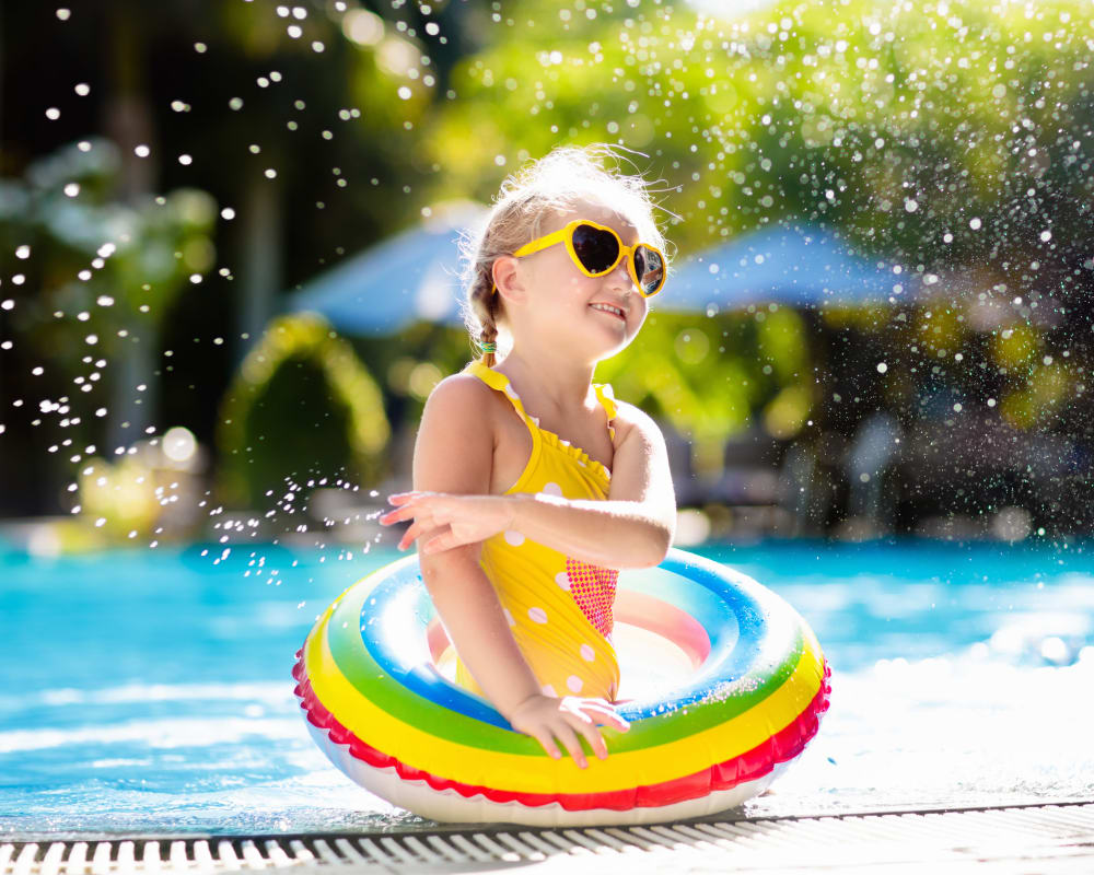 New resident enjoying the swimming pool on a hot day at Northwind Apartments in Reno, Nevada